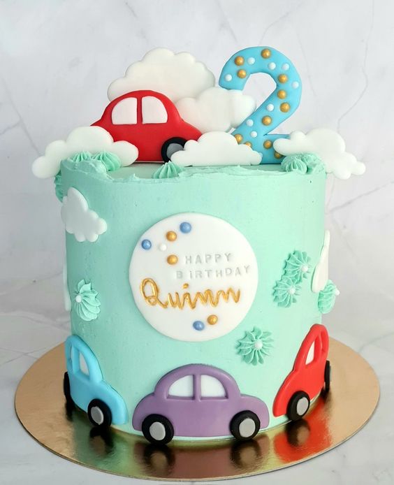 Delicious Cake Design - A Cars themed birthday cake featuring hand crafted  sugar figures of Lightning McQueen and Mater on top of the cake. Road  cones, cacti, stones, and tyres all hand